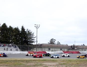 The Legends race off turn four.