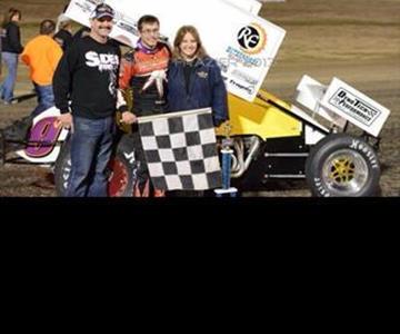 Chris and Anita Santucci celebrating her birthday with Derek in Victory Lane.