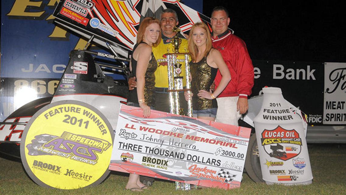 Johnny Herrera enjoys Lucas Oil ASCS presented by K&amp;N Filters National victory lane after topping Friday night's Loren Woodke Memorial feature event to kick off the 33rd Annual Jackson Nationals in Jackson, MN. (Rob Kocak photo)