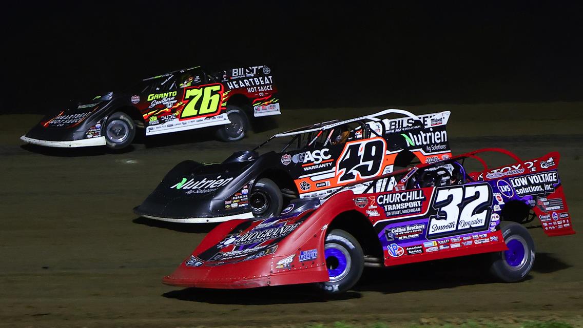 Bobby Pierce (32) - Jonathan Davenport (49) - Brandon Overton (76) battle at Marshalltown Speedway on May 13 (Josh James Artwork image)