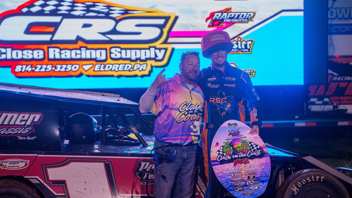 Tim Ward poses with IMCA TV Clash On The Coast promoter Peyton Taylor after capturing the Karl Kustoms IMCA Modified feature at Deep South Speedway on Feb. 27. The Mesa, Arizona native, now residing in Harcourt, Iowa, earned his first career series victory in commanding fashion. (Photo by AOM Creative)