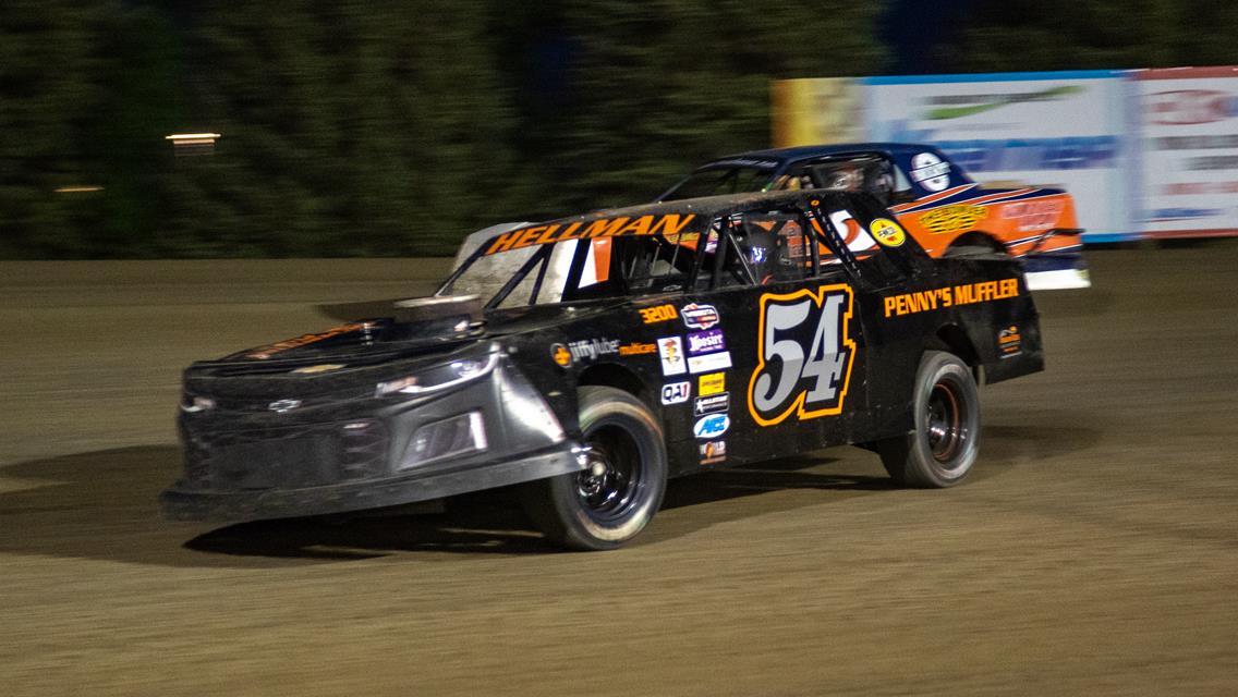 HELLMAN HOLDS ON FOR VICTORY