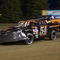 HELLMAN HOLDS ON FOR VICTORY