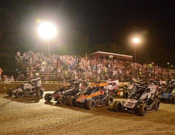 The midgets go four-wide for their feature parade lap