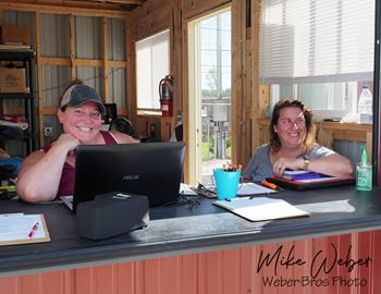 IRA Officials Tiffany Taylor and Kim Tennyson in the Wilmot Raceway Pit Sign in Booth