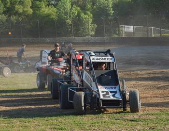 The midgets are pushed back to the pits after time trials